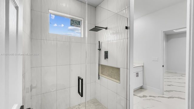 bathroom with vanity and a shower with shower door