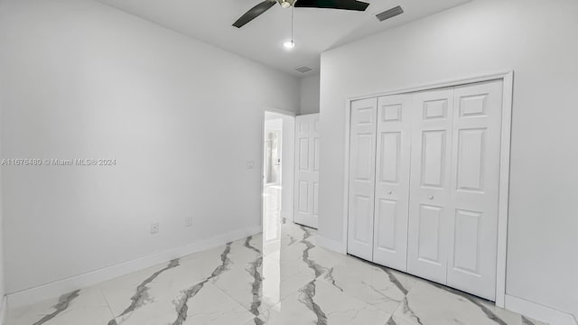 bedroom featuring ceiling fan and a closet