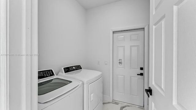 washroom featuring independent washer and dryer