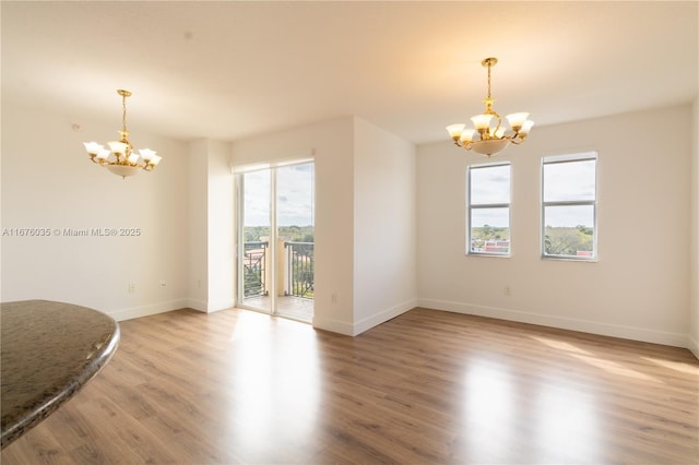9021 SW 94th St Unit 603, Miami, FL 33176 - empty room with a chandelier, baseboards, and light wood-style floors
