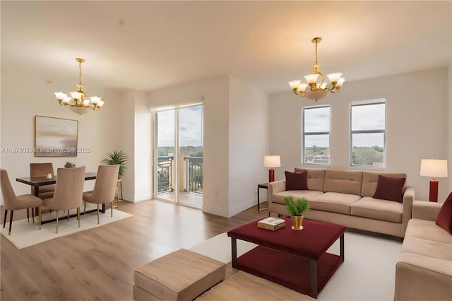 9021 SW 94th St Unit 603, Miami, FL 33176 - living area featuring a chandelier, wood finished floors, and baseboards