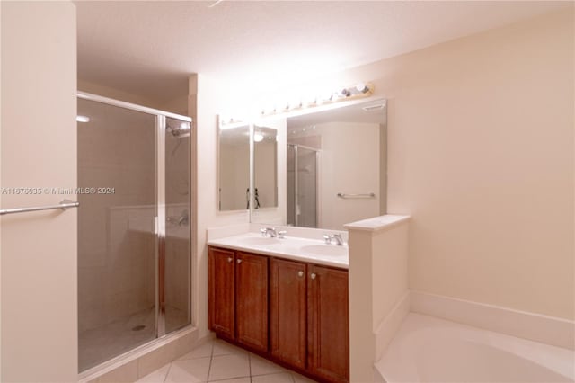 bathroom with vanity, shower with separate bathtub, and tile patterned floors