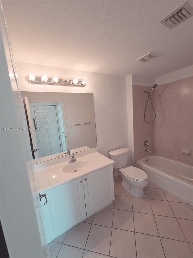 full bathroom with visible vents, toilet, vanity, and bathtub / shower combination