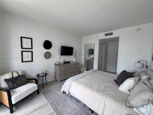 bedroom with light hardwood / wood-style floors