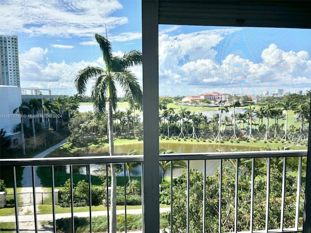 balcony featuring a water view