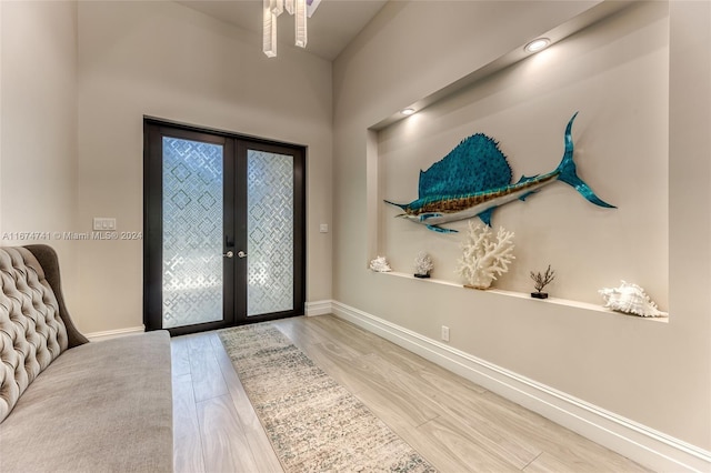 foyer featuring french doors and wood-type flooring