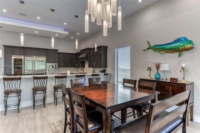 dining room featuring a high ceiling