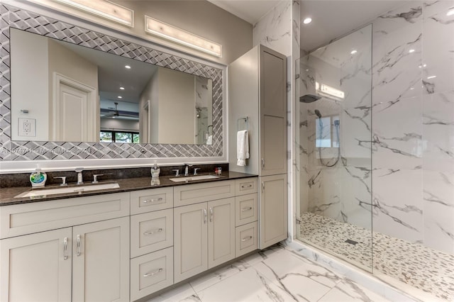 bathroom with decorative backsplash, vanity, and tiled shower