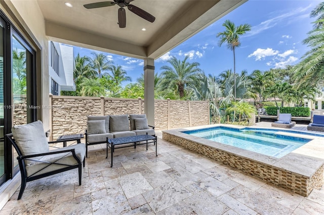 view of swimming pool featuring an in ground hot tub, a patio, and ceiling fan