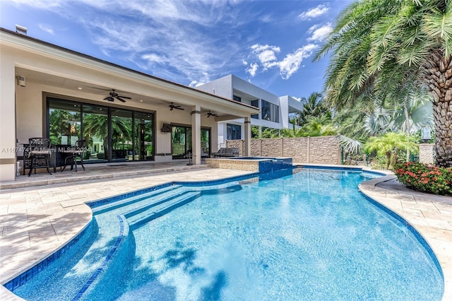 view of swimming pool featuring a patio and ceiling fan