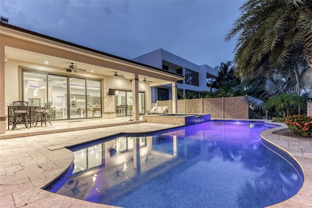 view of swimming pool with a patio and ceiling fan