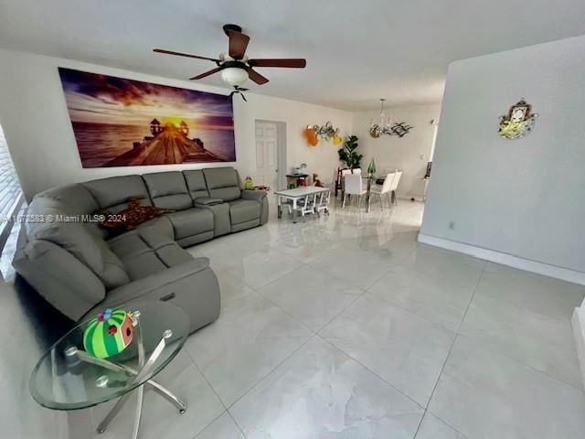 living room featuring ceiling fan