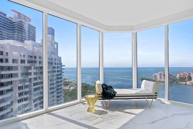 sunroom / solarium with a water view