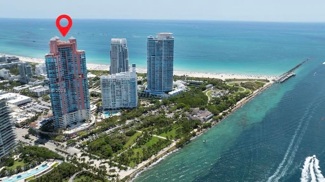 aerial view featuring a water view and a view of the beach