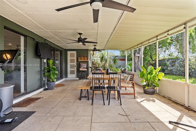 sunroom / solarium with ceiling fan and a wealth of natural light