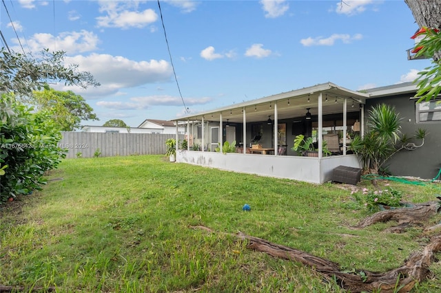 view of yard featuring a sunroom