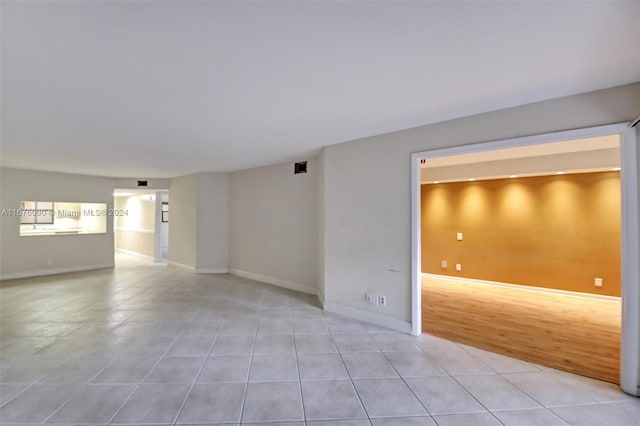 spare room featuring light hardwood / wood-style flooring