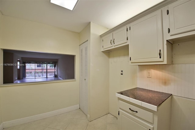 kitchen with light tile patterned floors