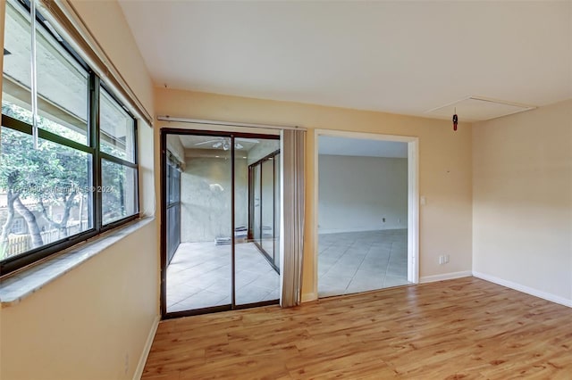 unfurnished room with light hardwood / wood-style floors