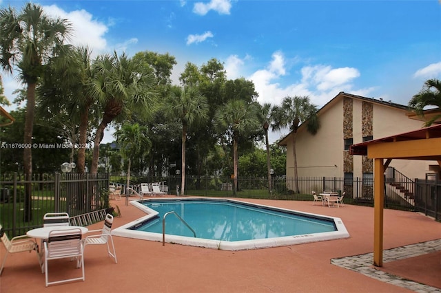 view of swimming pool featuring a patio