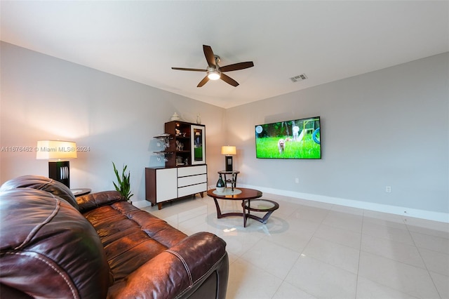 living room with light tile patterned flooring and ceiling fan