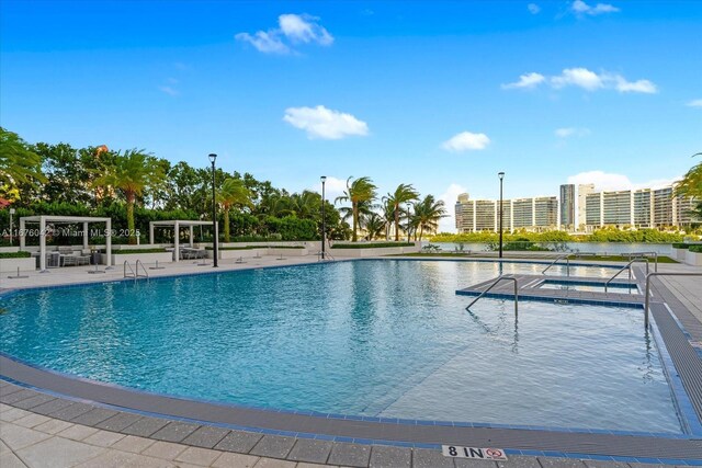 view of pool featuring a pergola and a patio area