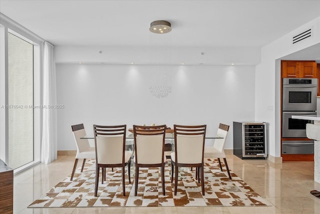 dining space featuring a wall of windows and wine cooler