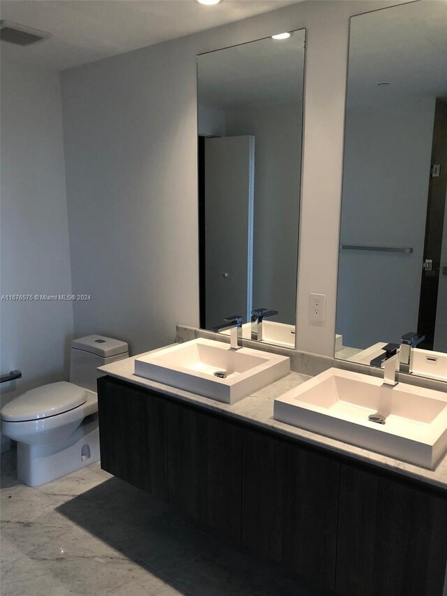 801 S Miami Ave Unit 3903, Miami, FL 33130 - full bathroom featuring toilet and double vanity
