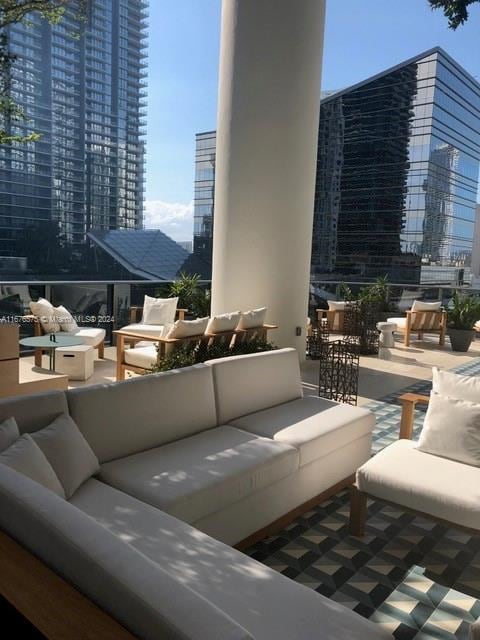 view of patio / terrace featuring a balcony and an outdoor living space