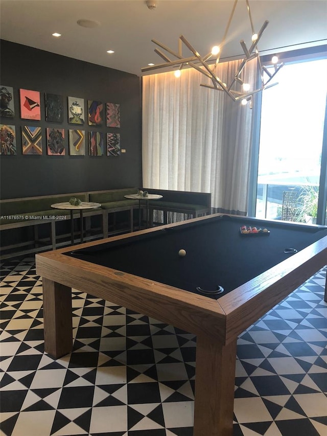 recreation room featuring billiards and a notable chandelier