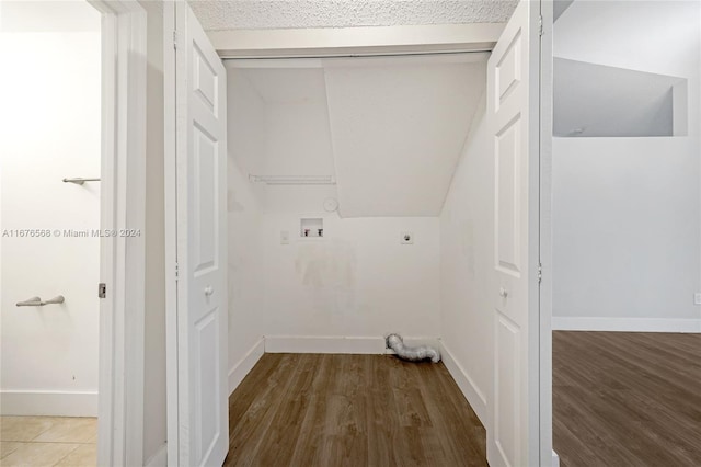 laundry area featuring hookup for an electric dryer, hookup for a washing machine, and wood-type flooring