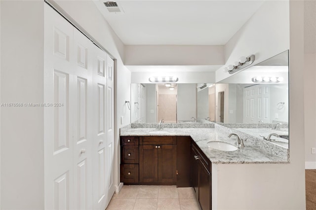 bathroom featuring vanity and tile patterned flooring