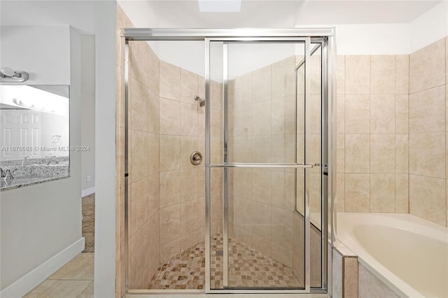 bathroom featuring independent shower and bath and tile patterned floors