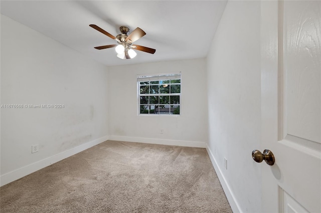 spare room with carpet flooring and ceiling fan