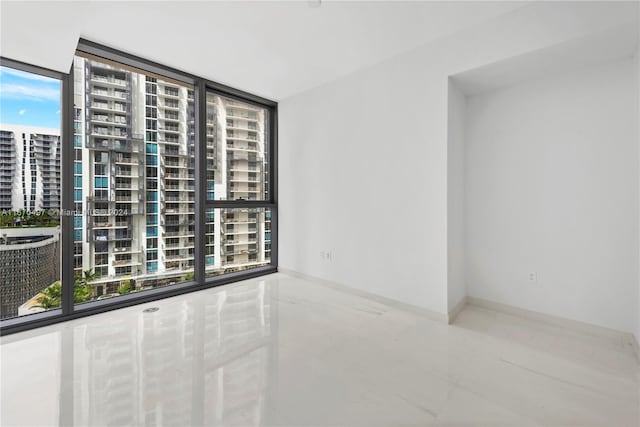 empty room featuring floor to ceiling windows