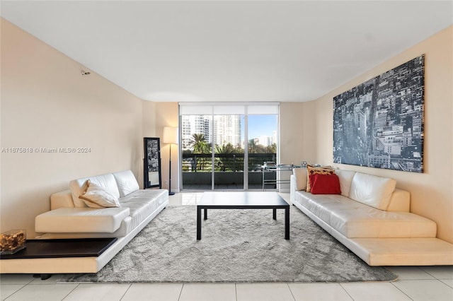 living room with tile patterned flooring and floor to ceiling windows