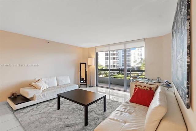 living room with light tile patterned flooring and floor to ceiling windows