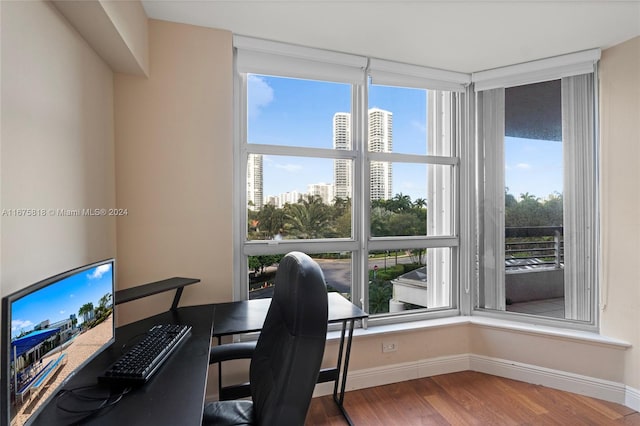 office area with hardwood / wood-style floors