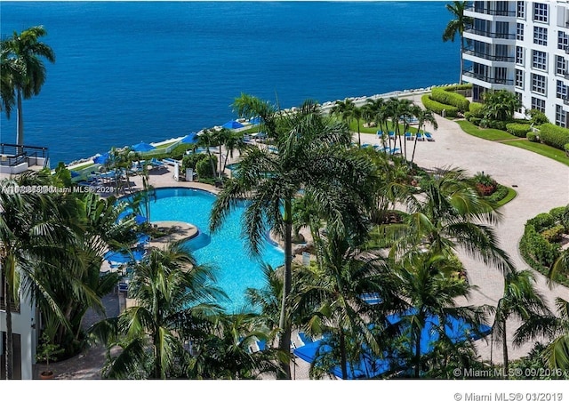 view of pool with a water view