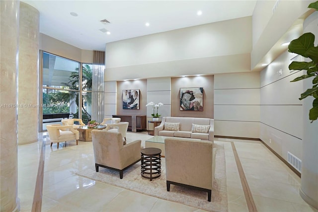 living room with a high ceiling