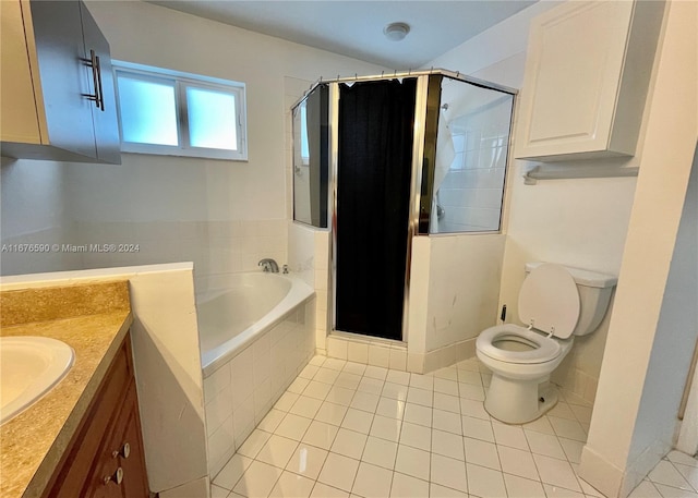 full bathroom with toilet, tile patterned floors, vanity, and separate shower and tub