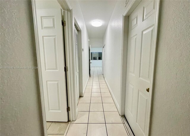 hallway with light tile patterned flooring