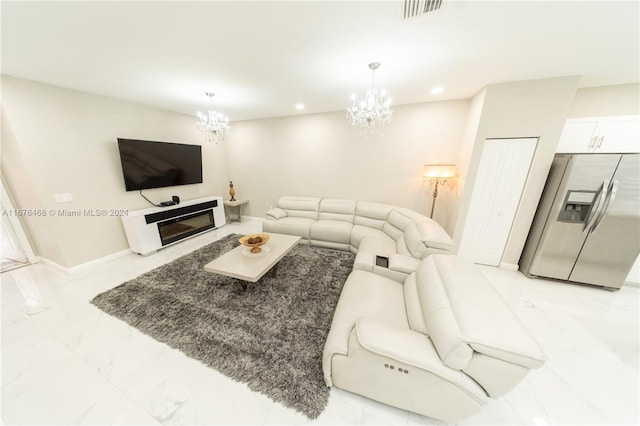 living room featuring a notable chandelier