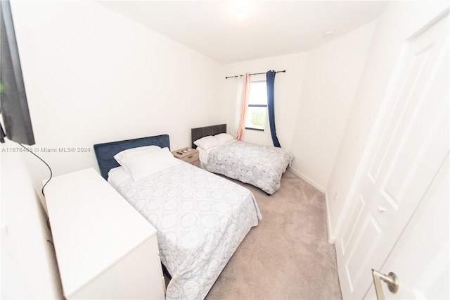 bedroom with light colored carpet