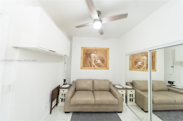 sitting room featuring electric panel and ceiling fan