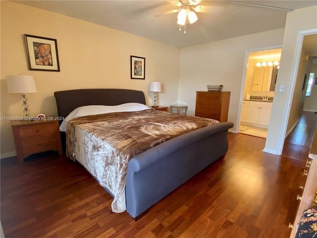 bedroom with dark wood-type flooring, ceiling fan, connected bathroom, and sink