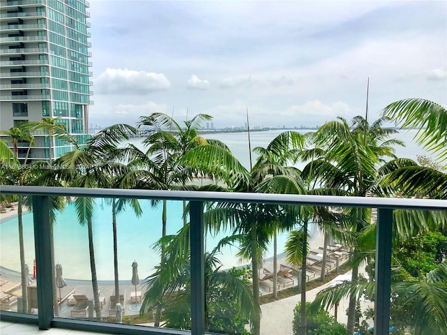 view of pool featuring a water view