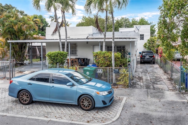 view of front of property featuring a carport