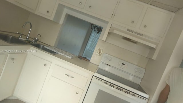 kitchen featuring white cabinetry