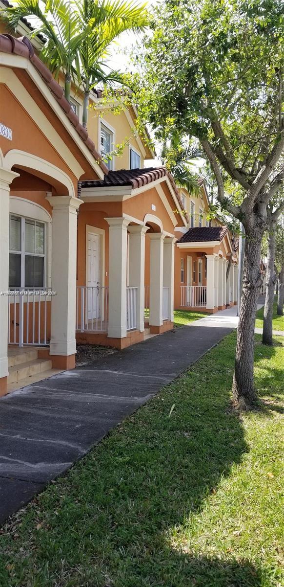 view of property exterior with a lawn